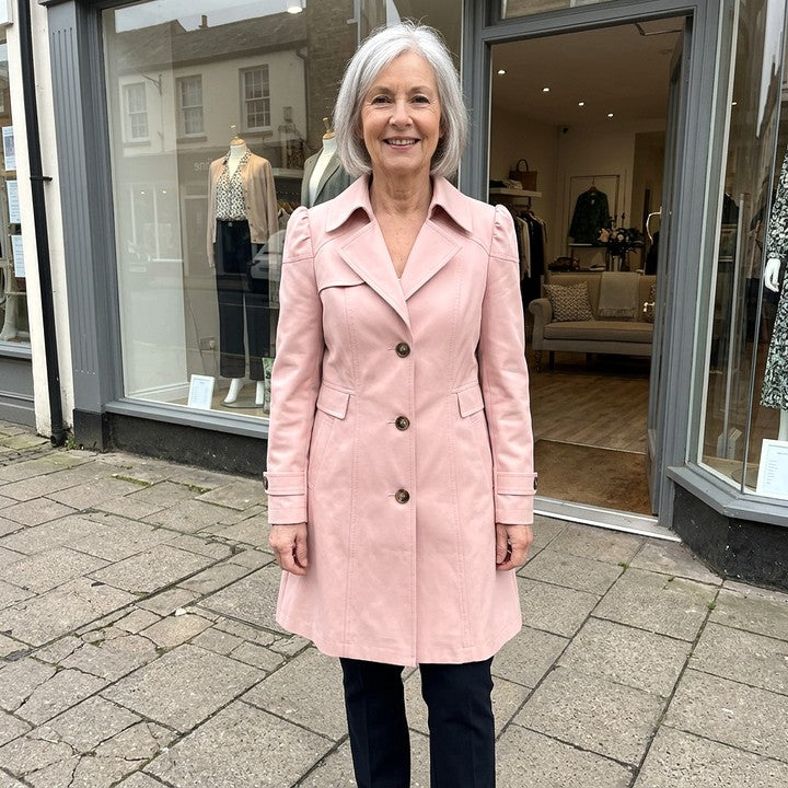 Caterina vintage coat in Blush, worn in front of a boutique