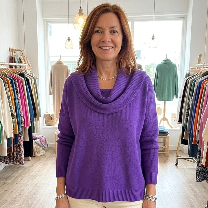 Juliette cowl neck jumper in Purple, worn in a boutique