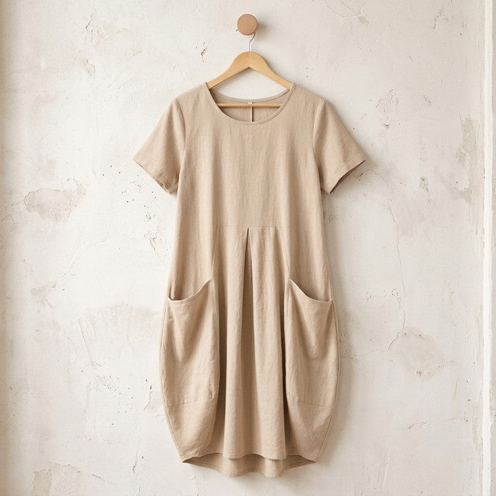 Kwani flowing dress in Beige on a hanger