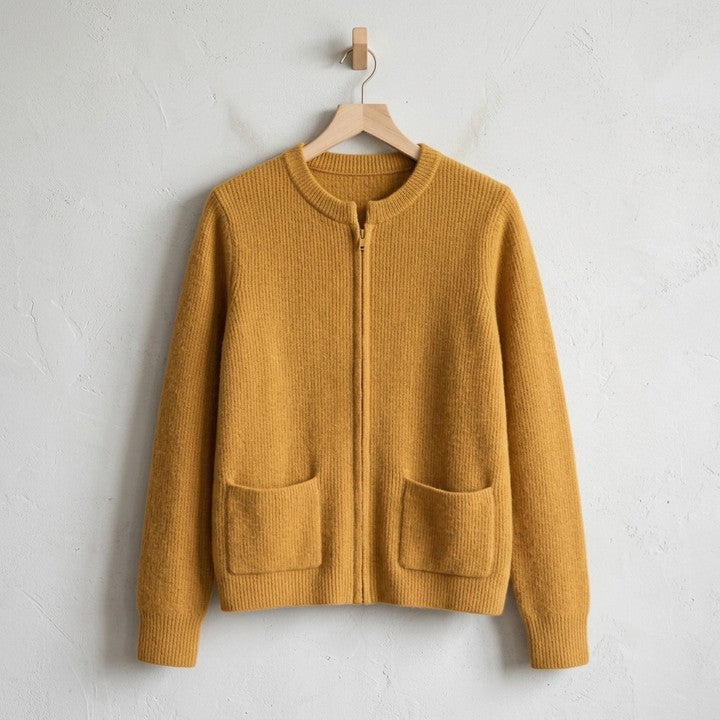 Margot zip-up cardigan in Mustard, on a hanger