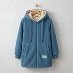 Phoebe cosy hooded jacket in Blue, on a hanger