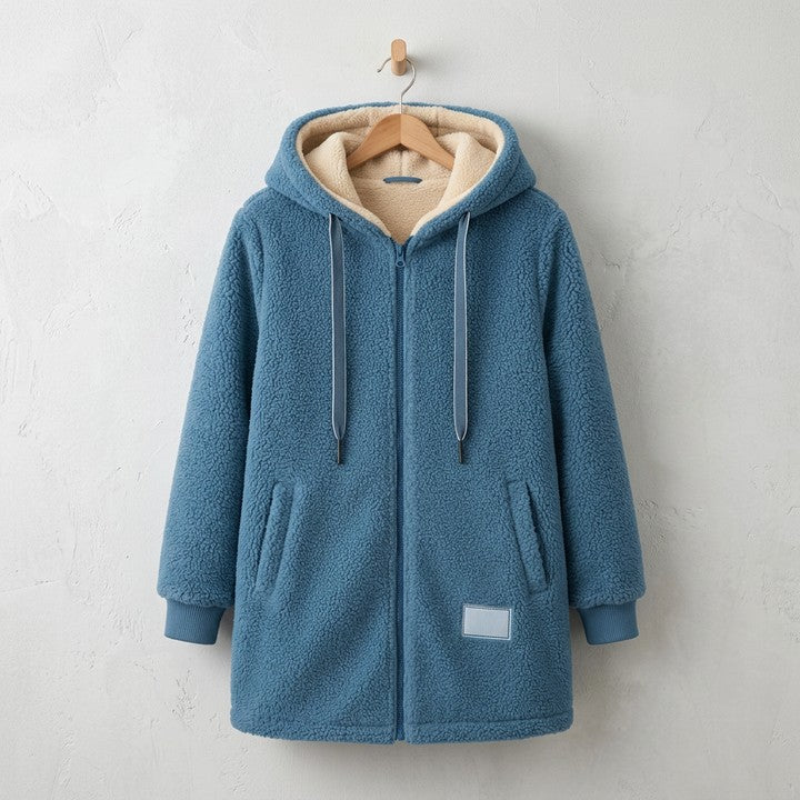 Phoebe cosy hooded jacket in Blue, on a hanger
